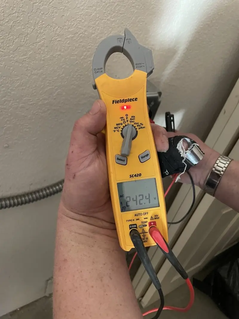 Voltage testing with clamp meter during Recessed Lighting Installation in Farmington